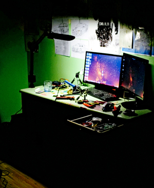 Two screens in a dark room.