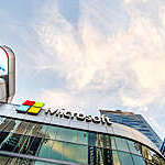 Close low-angle view of Microsoft logo on office building-