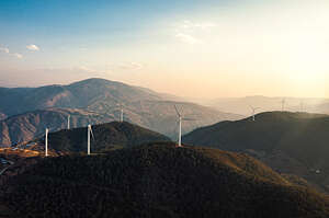 Drone video of wind farm on the mountain top, video taken in the Yishala county area in Panzhihua city, Sichuan Province, China. 

Around this city mountain, there are about 500mw wind farm, which is also a very famous mountain wind farm in China, producing clean energy every day. 

Video taken by drone device, camera moving leftwards.